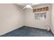 Cozy bedroom with carpet and a window at 18622 N 28Th Way, Phoenix, AZ 85050
