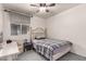 Small bedroom with carpet, a ceiling fan, and a desk with a chair at 18622 N 28Th Way, Phoenix, AZ 85050