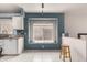 Cozy breakfast nook area with counter seating, a window with natural light, and blue textured walls at 18622 N 28Th Way, Phoenix, AZ 85050