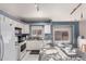 Bright kitchen features white cabinets, stainless steel appliances and granite countertops at 18622 N 28Th Way, Phoenix, AZ 85050
