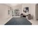Airy living space with neutral decor, a blue rug, and comfortable seating by a large window at 18622 N 28Th Way, Phoenix, AZ 85050
