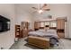 Spacious main bedroom featuring a ceiling fan and a dresser with mirror at 18622 N 28Th Way, Phoenix, AZ 85050