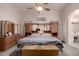 This main bedroom features neutral decor, a ceiling fan, and large dresser at 18622 N 28Th Way, Phoenix, AZ 85050
