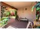 A covered patio featuring an outdoor gazebo, plants and comfortable seating area at 18622 N 28Th Way, Phoenix, AZ 85050
