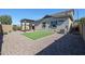 Wide backyard shot with a pergola, artificial grass, rock, and privacy walls at 1871 E Lantana Dr, Chandler, AZ 85286
