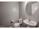 The half-bath features a modern sink, toilet, and mirror at 1871 E Lantana Dr, Chandler, AZ 85286