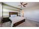 Charming bedroom with accent wall, ceiling fan, and ample natural light creating a cozy retreat at 1871 E Lantana Dr, Chandler, AZ 85286