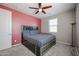Comfortable bedroom featuring a ceiling fan and a large bed in a well-lit space at 1871 E Lantana Dr, Chandler, AZ 85286