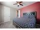 Spacious bedroom with carpet, ceiling fan, and plenty of closet space at 1871 E Lantana Dr, Chandler, AZ 85286