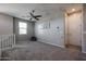 Large bonus room with carpet flooring, ceiling fan, natural light and neutral paint at 1871 E Lantana Dr, Chandler, AZ 85286