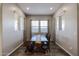Formal dining area bathed in natural light, featuring a wooden table and bench at 1871 E Lantana Dr, Chandler, AZ 85286