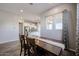 Dining area with view into the kitchen featuring tile floors, white trim and grey walls at 1871 E Lantana Dr, Chandler, AZ 85286