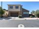 Two-story home featuring a two-car garage and a combination of stucco and wood siding at 1871 E Lantana Dr, Chandler, AZ 85286