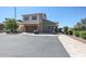 View of the home showing the landscaping, curb, sidewalk, and a two car garage at 1871 E Lantana Dr, Chandler, AZ 85286