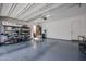 Spacious garage with epoxy flooring, shelving, and ample room for vehicles and storage at 1871 E Lantana Dr, Chandler, AZ 85286