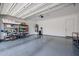 Spacious two-car garage featuring epoxy flooring, storage shelving and plenty of room for parking and storage at 1871 E Lantana Dr, Chandler, AZ 85286