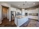 Modern kitchen featuring white cabinets, a center island, and stainless steel appliances at 1871 E Lantana Dr, Chandler, AZ 85286