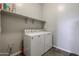 The laundry room is conveniently equipped with modern appliances and ample storage space at 1871 E Lantana Dr, Chandler, AZ 85286