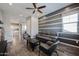 Open-concept living room with tile floors, a ceiling fan, and stylish decor at 1871 E Lantana Dr, Chandler, AZ 85286