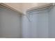 Empty closet with wooden rods at 1871 E Lantana Dr, Chandler, AZ 85286