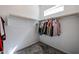 Bright walk-in closet featuring built-in shelving and clothing racks at 1871 E Lantana Dr, Chandler, AZ 85286