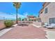 An enclosed backyard with privacy walls, palm tree, and a patio sitting area at 18807 N 42Nd Ave, Glendale, AZ 85308