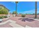 A backyard with wood-laid patio, decorative plants, and block wall fencing at 18807 N 42Nd Ave, Glendale, AZ 85308