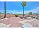 A tranquil backyard with brick-laid patio, mature landscaping, and lounge chairs at 18807 N 42Nd Ave, Glendale, AZ 85308