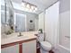 Bathroom with vanity, large mirror, shower/tub combination, and neutral color palette at 18807 N 42Nd Ave, Glendale, AZ 85308