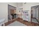 Bonus area featuring wet bar, neutral color palette, wood-style flooring, and access to living room at 18807 N 42Nd Ave, Glendale, AZ 85308