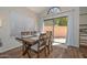 Cozy dining room featuring wooden table, chairs, and sliding door access to a private patio at 18807 N 42Nd Ave, Glendale, AZ 85308