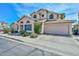 Charming two-story home featuring desert landscaping, a 2-car garage, and multiple arched windows at 18807 N 42Nd Ave, Glendale, AZ 85308