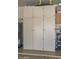 A garage with built-in storage cabinets and shelving at 18807 N 42Nd Ave, Glendale, AZ 85308