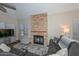 Comfortable living room featuring a stone fireplace and modern furniture at 18807 N 42Nd Ave, Glendale, AZ 85308