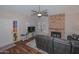 Comfortable living room with modern furniture and brick fireplace at 18807 N 42Nd Ave, Glendale, AZ 85308