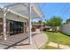 Charming backyard featuring a pergola, lush lawn, and brick patio at 2013 E Solano Dr, Phoenix, AZ 85016