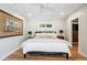 Cozy bedroom with hardwood floors, neutral walls, and a comfortable bed at 2013 E Solano Dr, Phoenix, AZ 85016