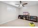 Versatile room with ceiling fan, natural light, and space for exercise equipment at 2013 E Solano Dr, Phoenix, AZ 85016