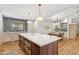 Spacious kitchen featuring a large island with seating and modern appliances at 2013 E Solano Dr, Phoenix, AZ 85016
