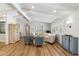 Spacious living room with vaulted ceilings, hardwood floors, and plenty of seating at 2013 E Solano Dr, Phoenix, AZ 85016