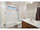 Full bathroom features a single sink vanity and shower-tub combination at 20160 N Riverbank Rd, Maricopa, AZ 85138