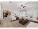 Spacious living area showcasing an open-concept design, contemporary decor, and lots of natural light at 20160 N Riverbank Rd, Maricopa, AZ 85138