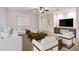 Bright living room featuring neutral paint colors, contemporary decor, and an accent rug at 20160 N Riverbank Rd, Maricopa, AZ 85138