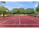 Basketball court in a community featuring mature trees and community spaces at 20563 E Carriage Way, Queen Creek, AZ 85142