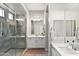 Beautiful bathroom featuring a glass shower, double sinks, and modern finishes at 20563 E Carriage Way, Queen Creek, AZ 85142