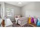 Cozy bedroom with stylish décor, including a bed with a playful arrangement of pillows at 20563 E Carriage Way, Queen Creek, AZ 85142