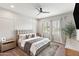 The main bedroom boasts an upholstered headboard, a decorative rug, and soothing natural light at 20563 E Carriage Way, Queen Creek, AZ 85142