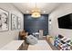 This playroom is thoughtfully arranged with a play kitchen, custom wall details, and great lighting at 20563 E Carriage Way, Queen Creek, AZ 85142