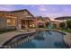 Beautiful backyard pool, lounge chairs, umbrellas, and plenty of room for entertaining at 20563 E Carriage Way, Queen Creek, AZ 85142