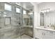 Gorgeous bathroom features a large walk-in shower with modern fixtures and white countertops at 20563 E Carriage Way, Queen Creek, AZ 85142